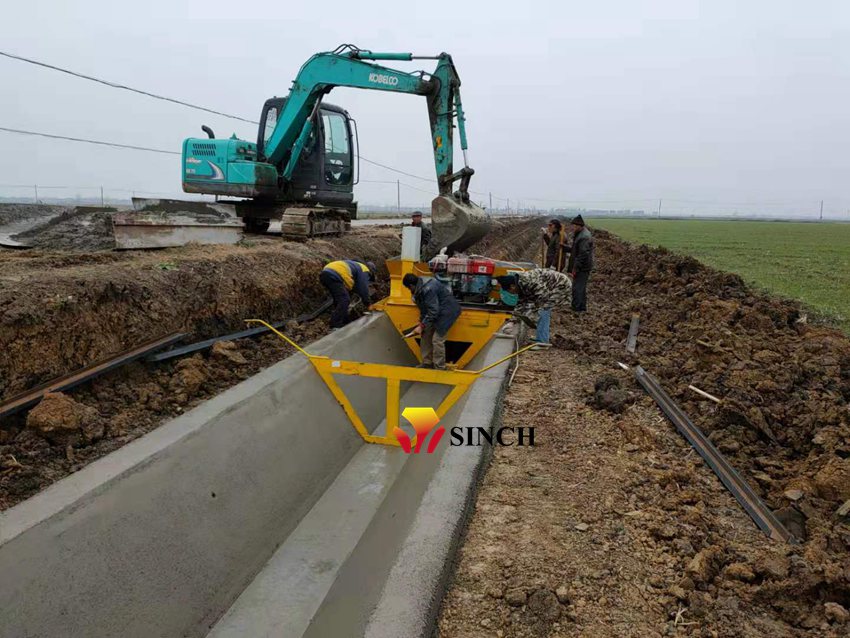 Concrete canal paving machine